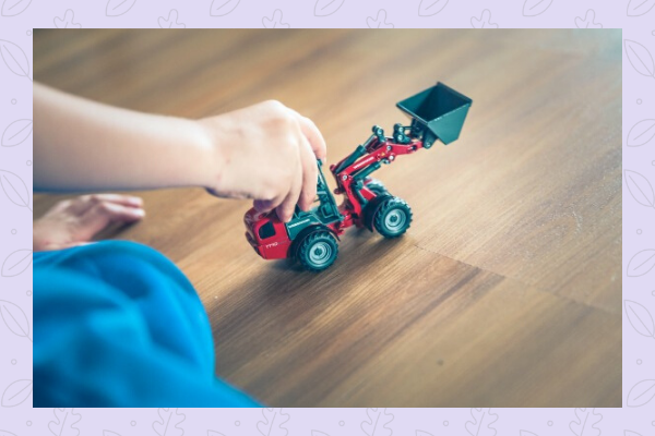 child playing with truck toy