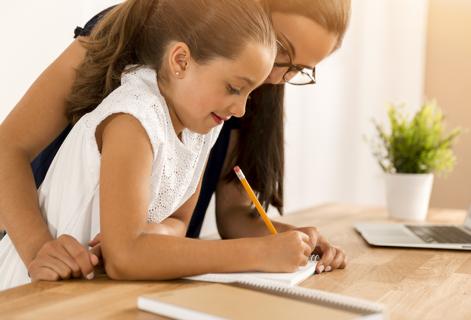 Mom helping kid study